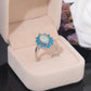 Versilberter Ring mit weißem und blauem Feueropal 